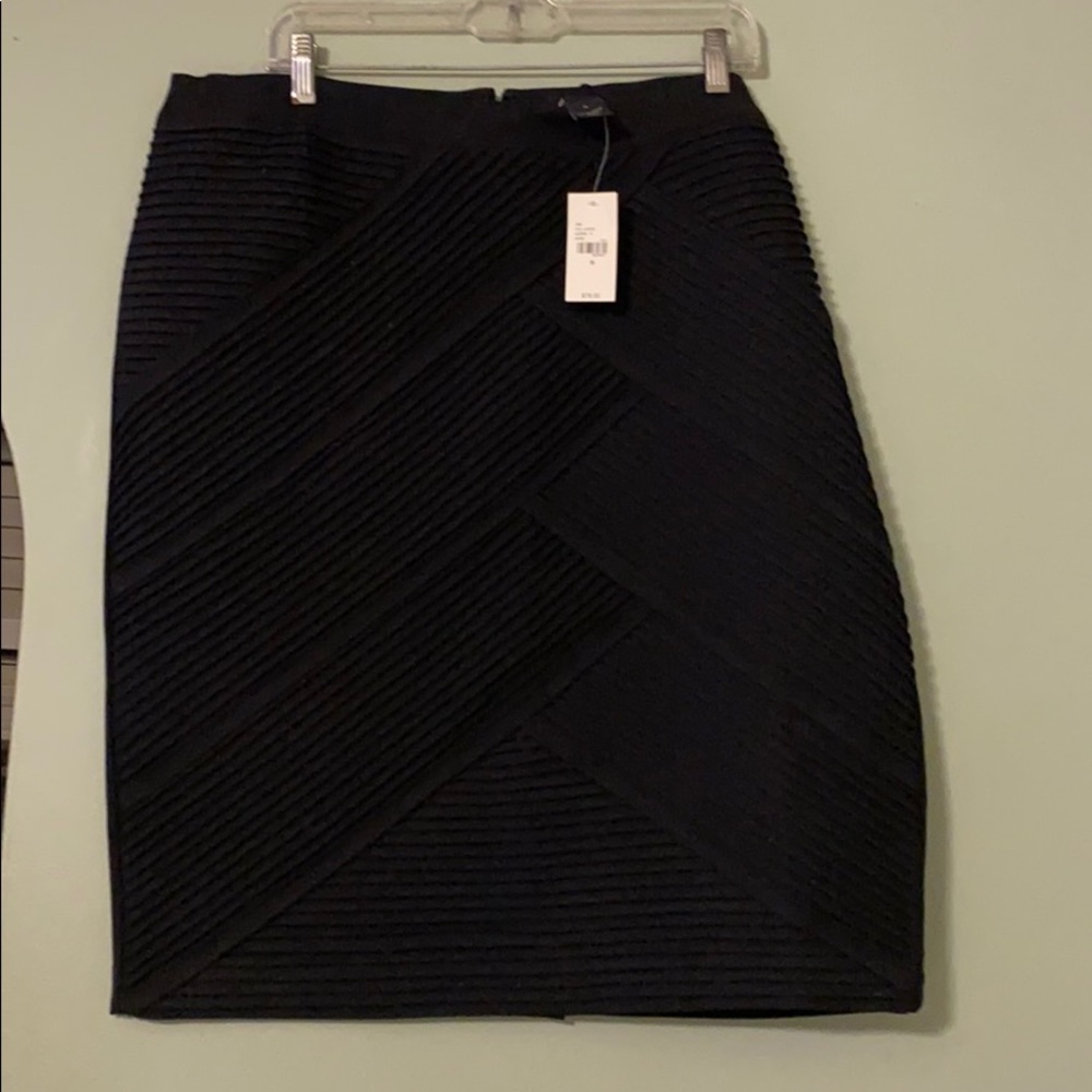 Knee length black plus size skirt. Very flattering